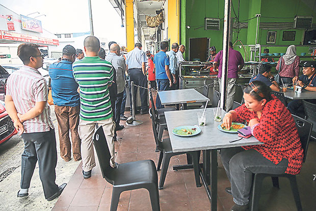 Join the queue for your nasi ganja for lunch.