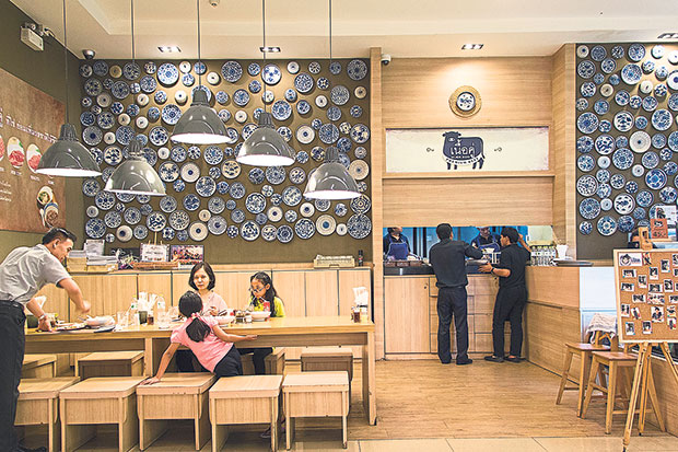 The feature wall of blue and white china plates.