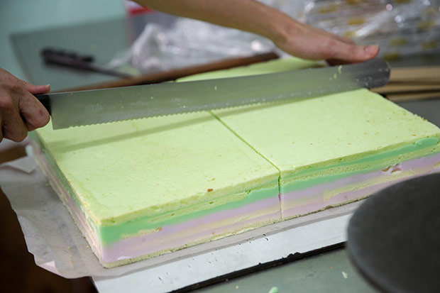 Once the cake is completed, it’s cut into rectangle pieces.