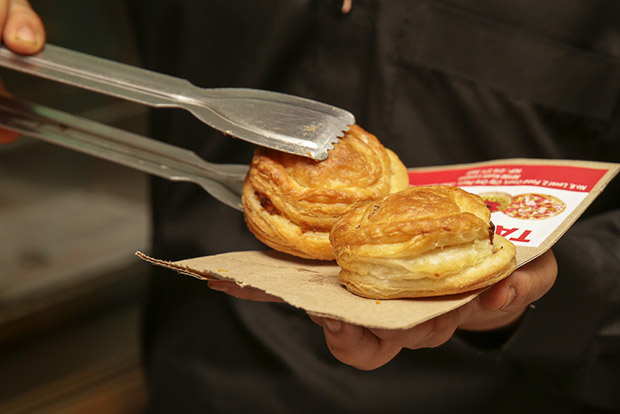 A must-eat at Taj Bakery is their flaky chicken pie.