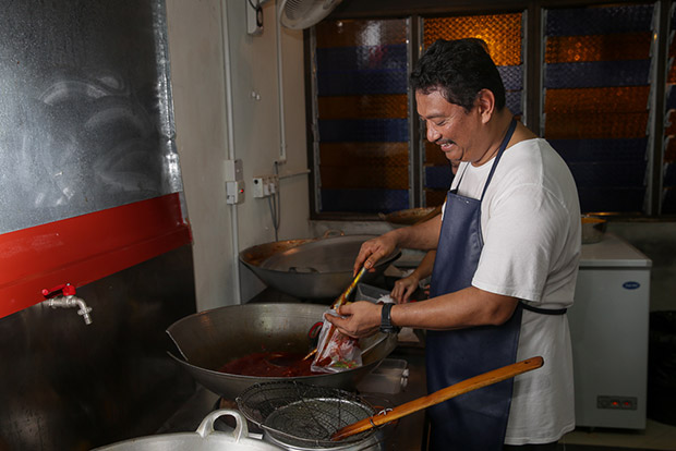 Wan Ameer Ruzman bin Wan Salaidin is taking a break from his IT business to help at the eatery.