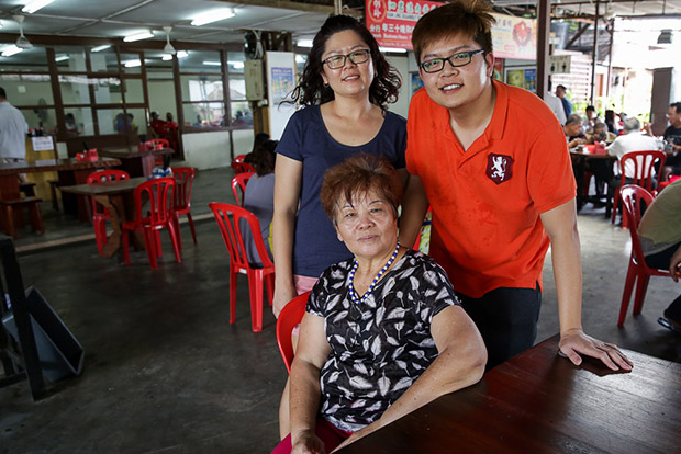 Karen Soh (middle) with her two children, Xan Ling and Marcus who also help out with the eatery.