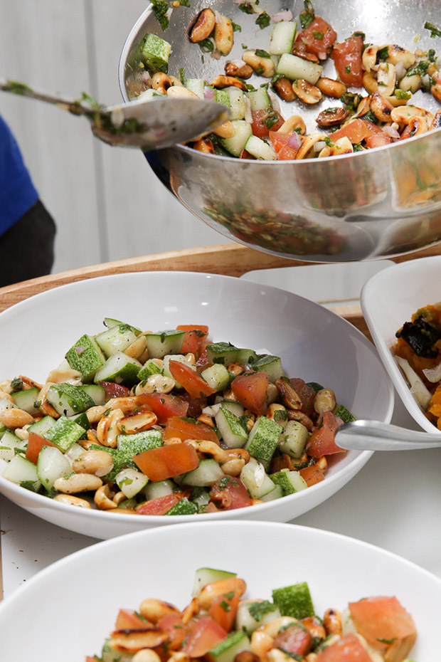 Dishing up the refreshing Badam, a salad made with tomatoes, cucumbers, Himalayan salt and toasted whole peanuts.