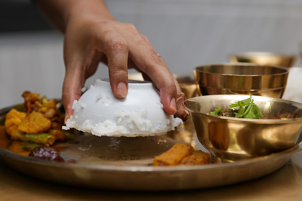 Adding the rice to the Thakali set.