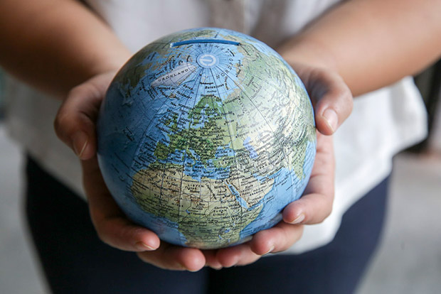 Save your cents in this handmade cartographic globe bank for your next trip.