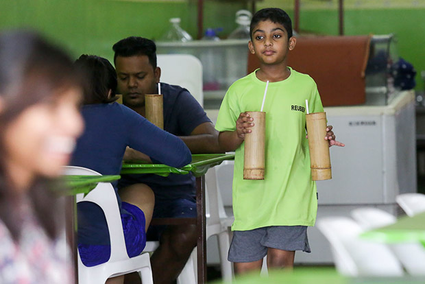 Stellamary’s nephew Reubenn helps out by delivering the drinks served in bamboo tubes.