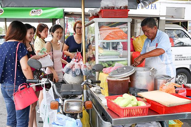 Customers will pack home their rojak to enjoy at home.