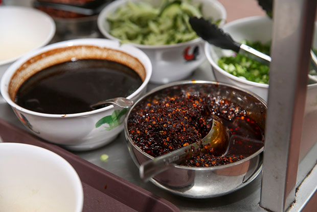 The secret behind the delicious noodles is Wang’s homemade chilli sauce using ingredients sourced from Guizhou.