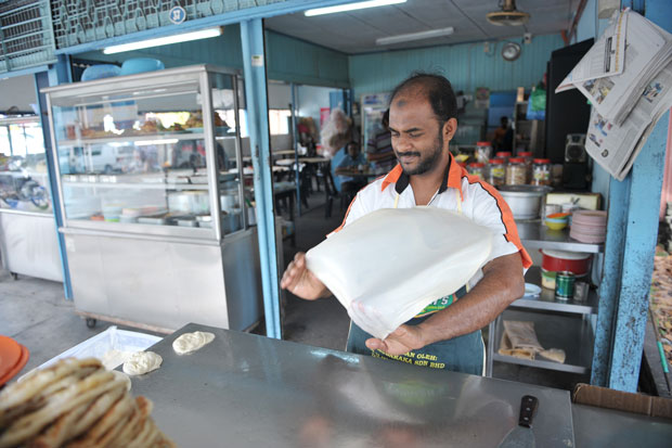 The making of the roti canai at Kedai Omar.
