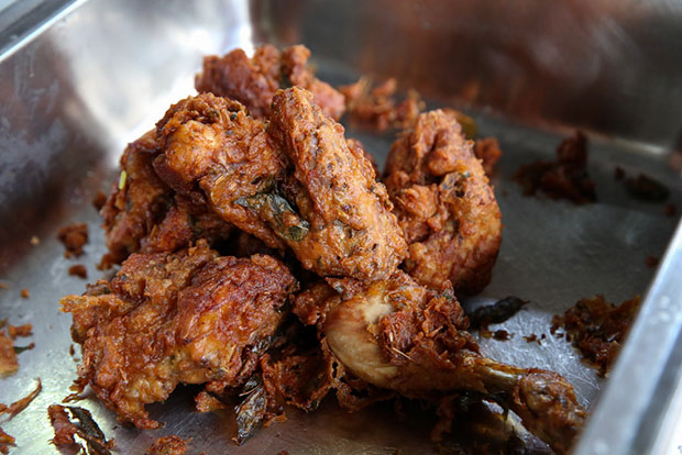 Bite into their juicy ayam goreng that is lightly coated with fried batter sprinkled with curry leaves.