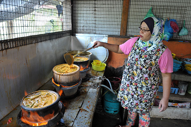 Claypot fish curries in the making in the kitchen.