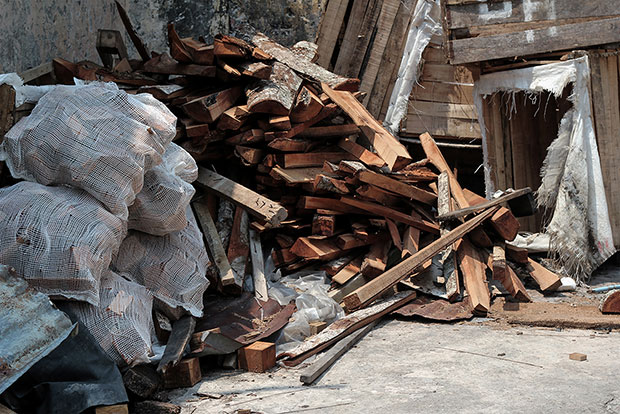 Back lanes are filled with second-hand wood and other detritus