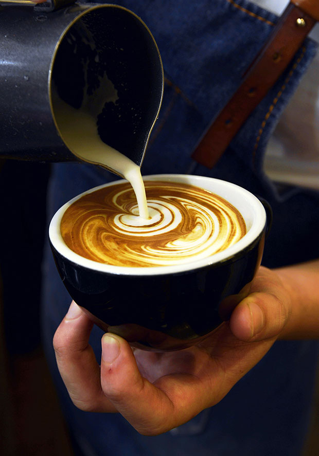 Pouring beautiful latte art takes practice