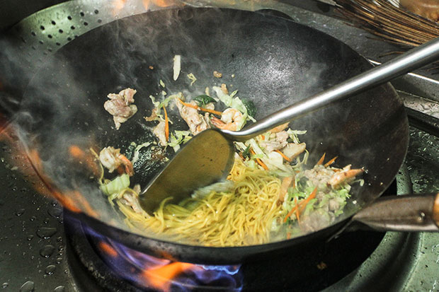 Frying up the noodles requires lots of skills