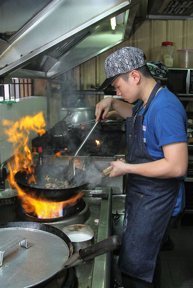 Vincent Tan may just be 21 years old but he’s a pro when it comes to frying up items in the kitchen