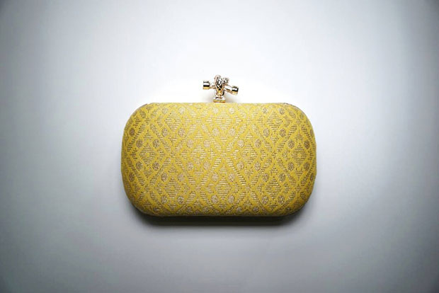 Understated yet elegant yellow songket minaudière.