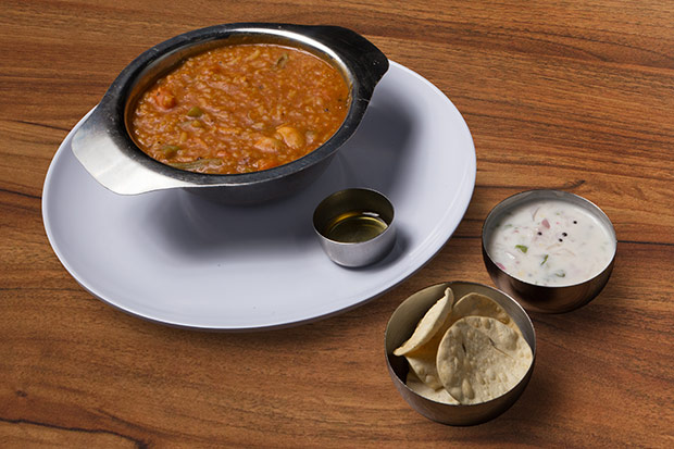 One spoonful of the bisi bele bhath or rice cooked with lentils and vegetables, is never enough.