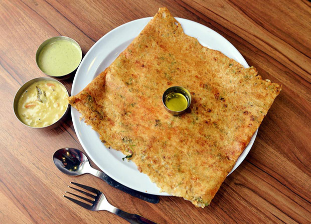 The ultra thin, crispy onion dosa is delicious with onions, chopped green chillies, coriander, cumin seeds and coconut.