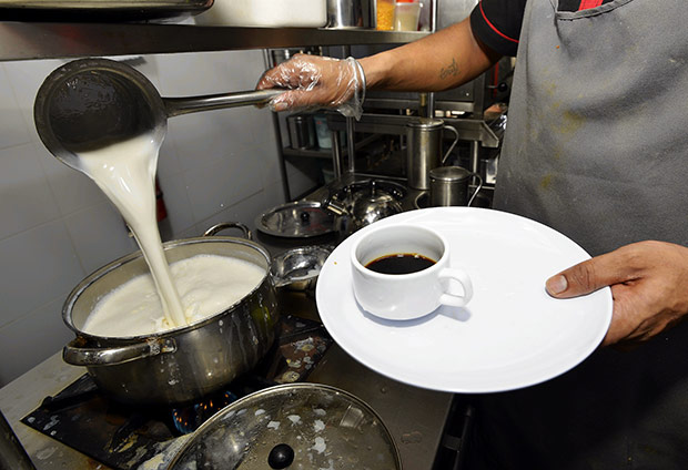 Fresh cow’s milk is heated up to add to the coffee.