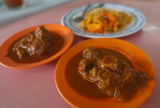 The nasi biryani is served with a spicy mutton curry