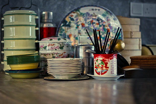 Retro paraphernalia such as tiffin carriers and enamel dishes help create a homey atmosphere