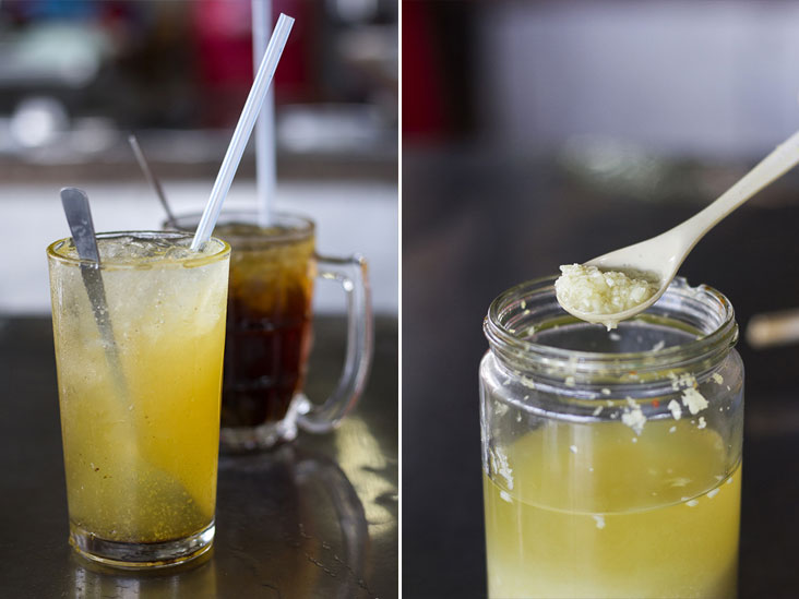 Refreshing calamansi juice (front) and iced mata kuching drink (back) (left). Locals in Sitiawan enjoy adding pickled garlic to their loh mee (right)