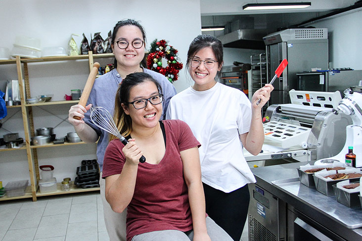 The bakers at Good Ground Bakery share the same philosophy in baking with Sarah, like Rachel Gan Rae Xian (in blue) and Lee Yuin Yi (in red).