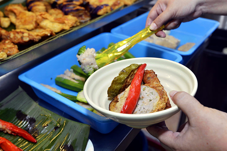 Pick from a choice of around 20 varieties of yong tau foo stuffed with fish paste and minced pork.