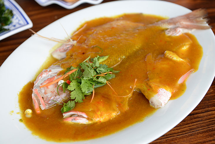 Steamed fish in a golden sweet and spicy sauce at Half Acre Restaurant