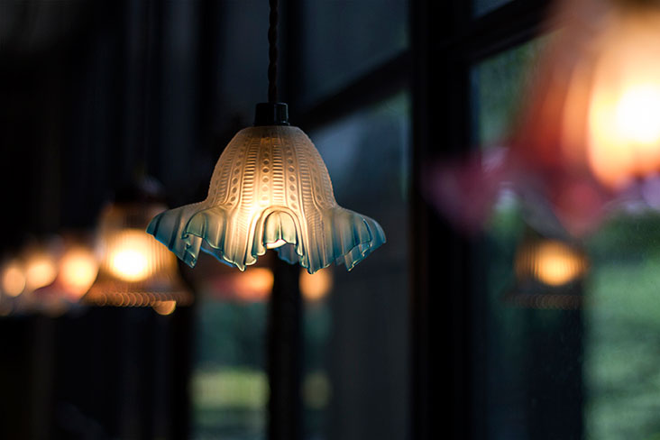 Low-hanging lamps at Some Time Blue create a romantic ambience