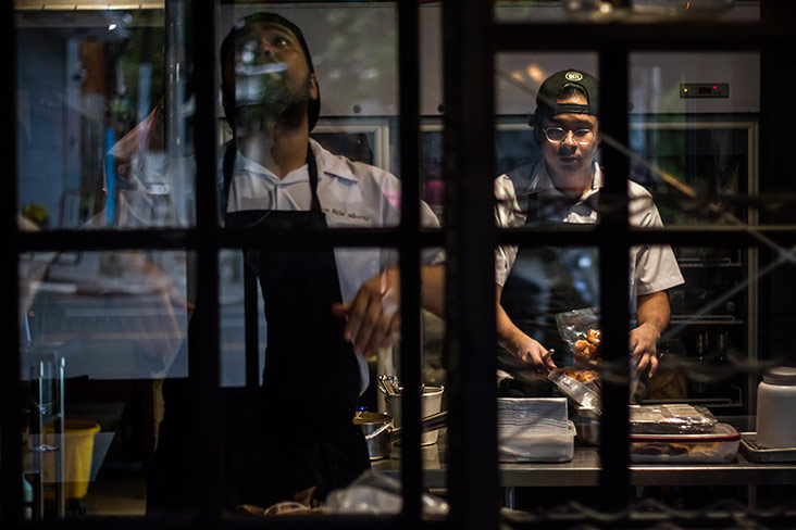 Kitchen bustling with prep work.