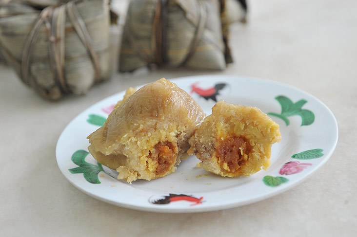 Cantonese zhong has a paler colour and is filled with green beans, pork and salted egg yolk.