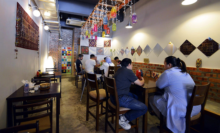 The eatery is decorated with hand painted jars by Sara and photos of their friends enjoying their shawarma.