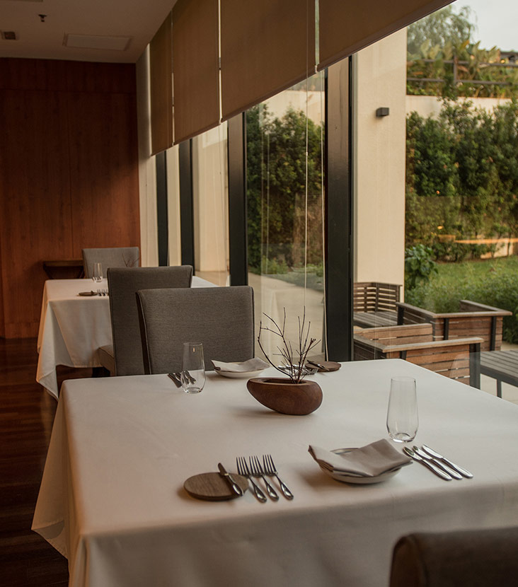 Look out to the university campus grounds when you dine at Dewakan.