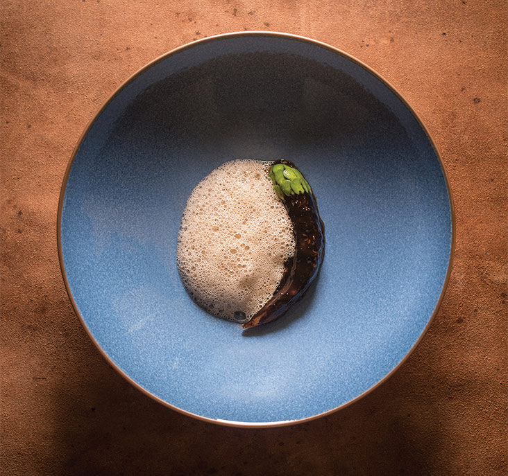 The roast eggplant with keluak is simply divine with its umami-rich paste paired with a white mushroom foam, thanks to an emulsion made from the candlenut oil.