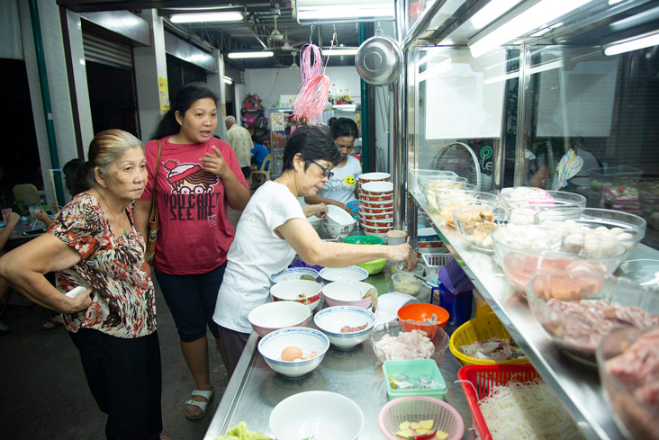 Tan Lay See taking orders at the stall.