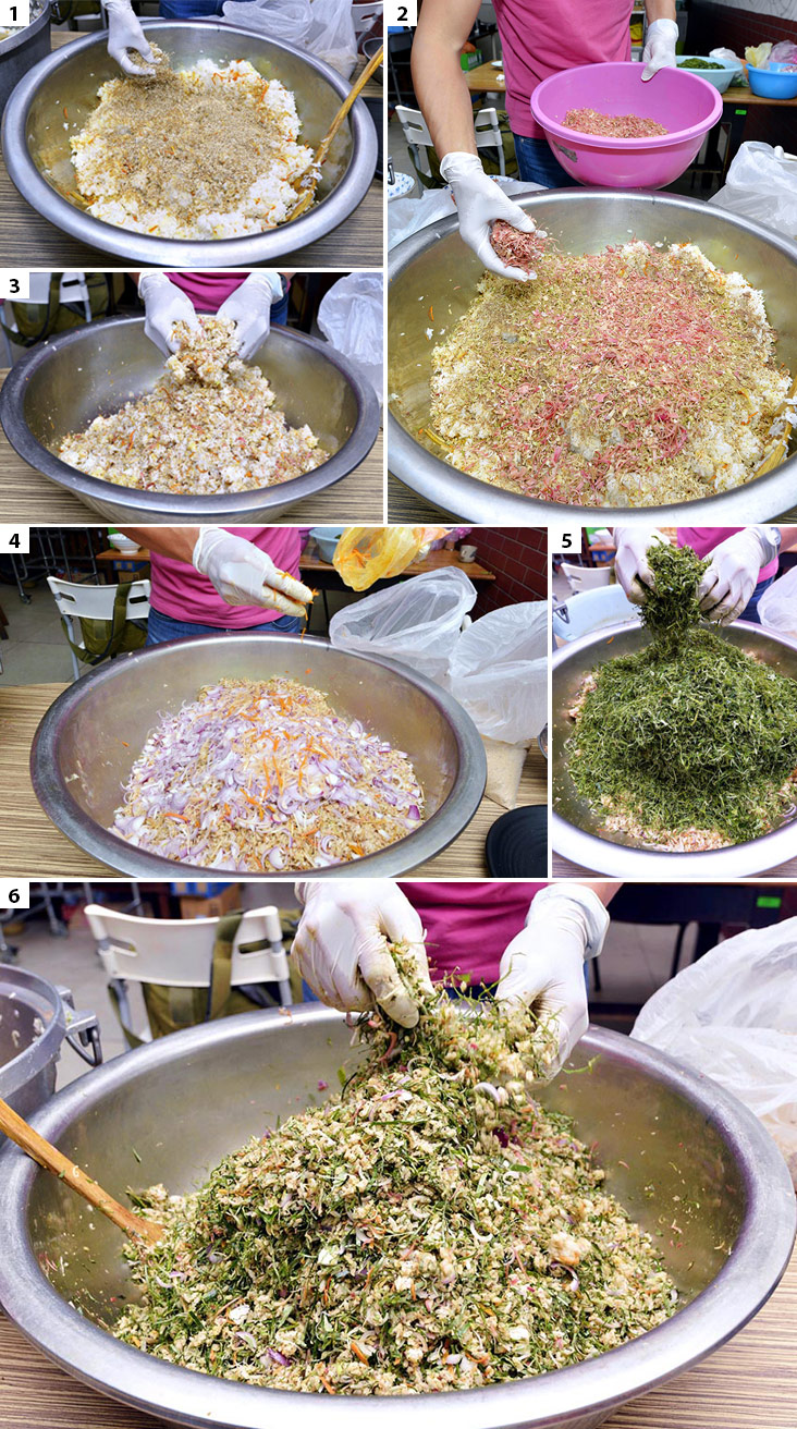 (1) Once the rice is cool enough, it’s sprinkled with the dry ingredients like belacan and dried shrimps to mix. (2) The harder herbs like torch ginger flowers and lemongrass are added next. (3) You need to mix the herbs and ingredients thoroughly with the rice. (4) Chopped shallots and turmeric are added to the nasi ulam. (5) The softer, cut fresh herbs are added at the end for the nasi ulam. (6) Once the herbs are added, you got to mix it all together to get the flavours for the nasi ulam.