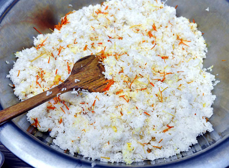 The rice cooked for nasi ulam is mixed with galangal and turmeric.
