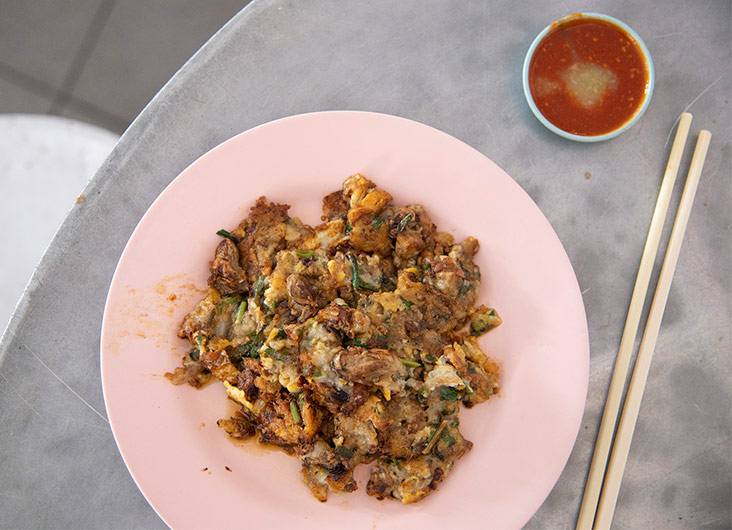 The or chien is served with chilli sauce.