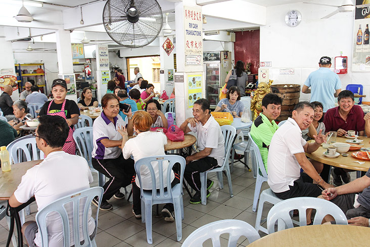 The corner coffeeshop is busy with the breakfast crowd.