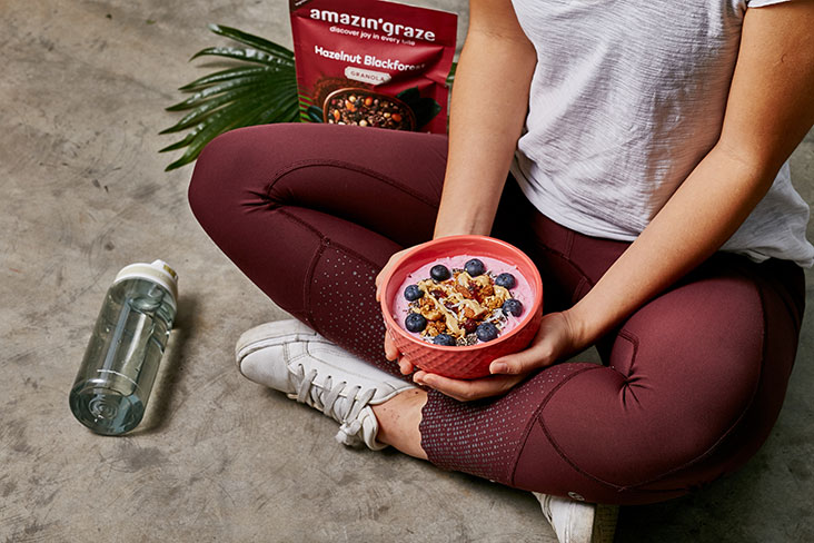 Fuel up for a workout with a smoothie bowl topped with hazelnut black forest granola.