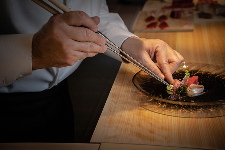 Chef Kiichi Okabe plates up the omakase course at Sushi Ryu