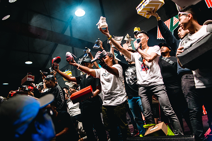 Trading pit participants showing off their pair of sneakers