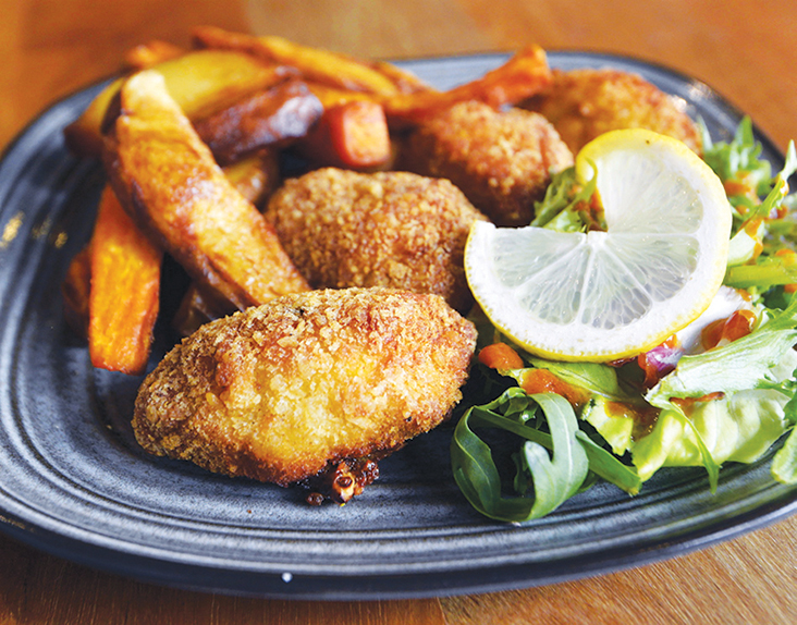 Enjoy a plate of salmon pomodoro pasta served with feta cheese at the bakery