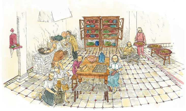 Busy cooking traditional Nyonya fare.