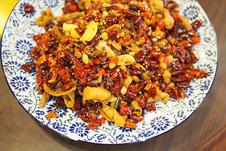 Crispy and delicious: Sichuan dried chillies with peppercorns stir fried with deep fried pig’s colon.