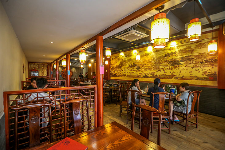 The restaurant spans two floors and is decked out with Chinese wood furniture and paintings.