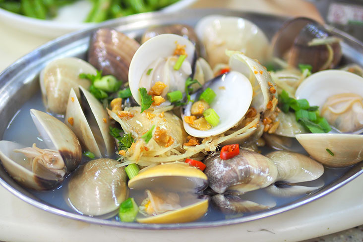 The steamed clams are perfectly cooked and accompanied with a sweet broth laced with Chinese wine.