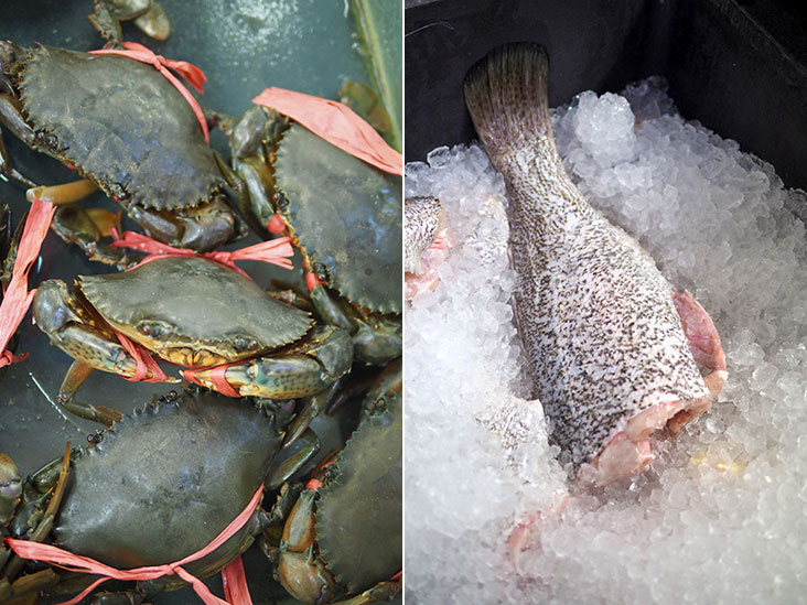 The crabs are sourced from Matang (left). The siakap fish is kept chilled under a bed of ice (right).