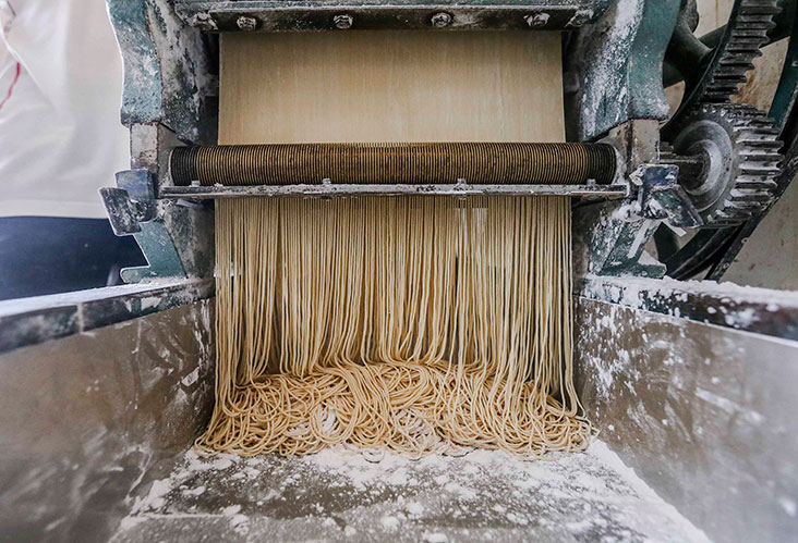 A cutter will cut the dough into fine strands.